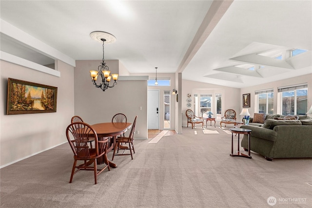 carpeted dining area with lofted ceiling with beams and a chandelier