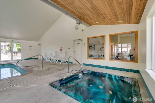 pool with an indoor in ground hot tub