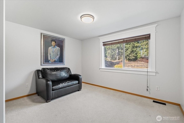 sitting room featuring carpet, visible vents, and baseboards