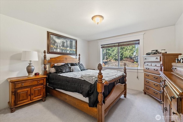 bedroom featuring light carpet