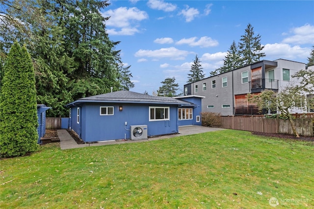 back of house featuring a patio area, fence, ac unit, and a yard