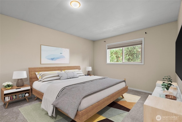 bedroom with carpet floors and baseboards