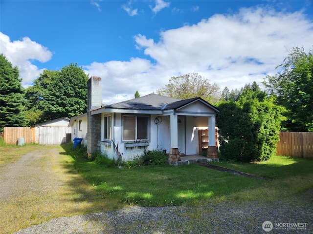 160 Gharet Rd, Randle, WA 98377 - view of front of house with covered porch, a chimney, stucco siding, and dirt driveway