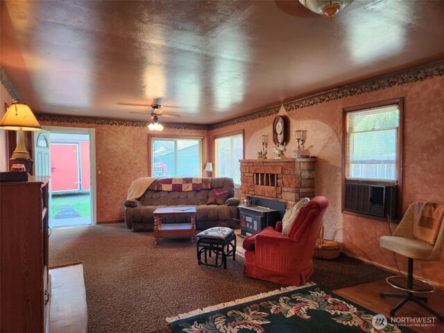 160 Gharet Rd, Randle, WA 98377 - living room with wallpapered walls, ceiling fan, a fireplace, carpet floors, and cooling unit