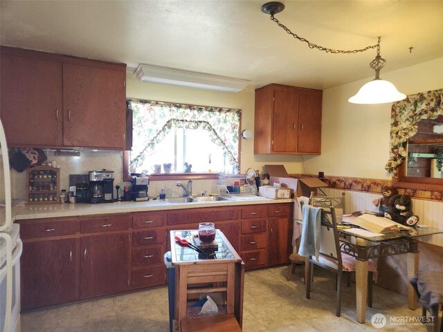 160 Gharet Rd, Randle, WA 98377 - kitchen with a sink, light countertops, pendant lighting, and radiator