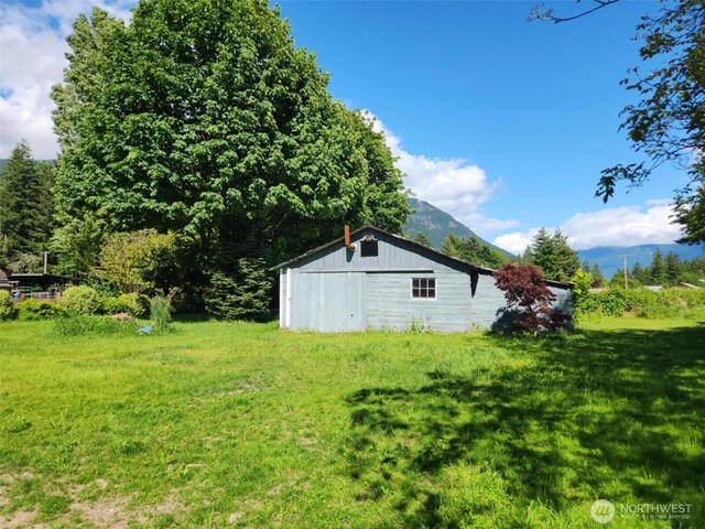 160 Gharet Rd, Randle, WA 98377 - view of grassy yard featuring an outdoor structure, a mountain view, and a pole building
