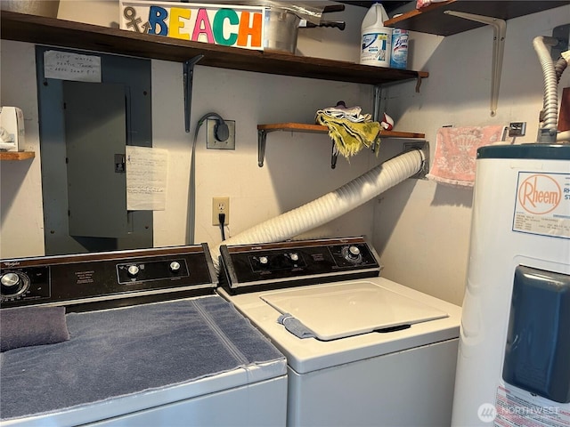 clothes washing area with independent washer and dryer, electric panel, laundry area, and electric water heater