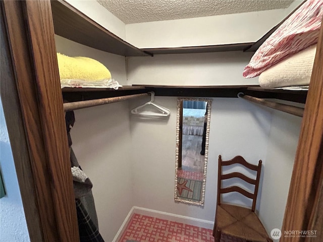 spacious closet featuring tile patterned floors