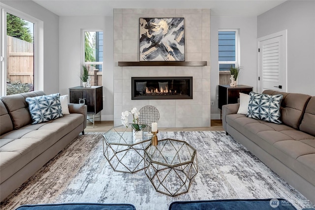 living area with wood finished floors and a fireplace