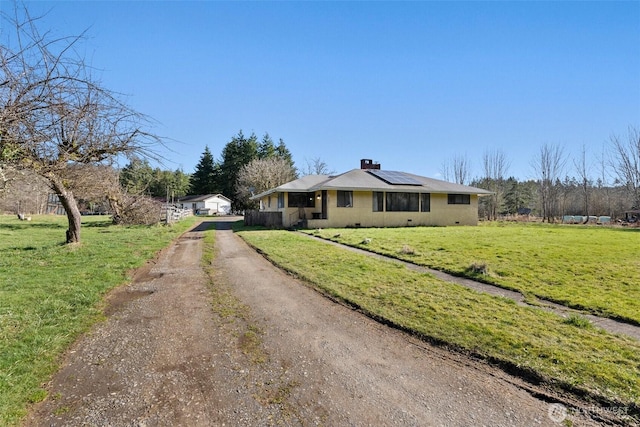 exterior space featuring dirt driveway