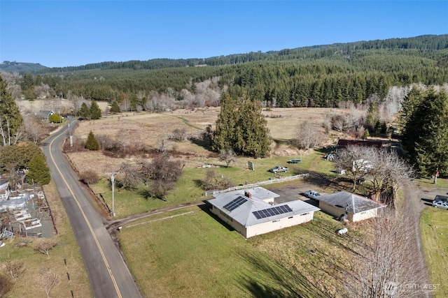 aerial view featuring a view of trees