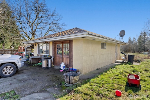 view of property exterior with fence