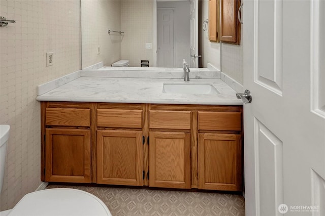 bathroom with vanity and toilet