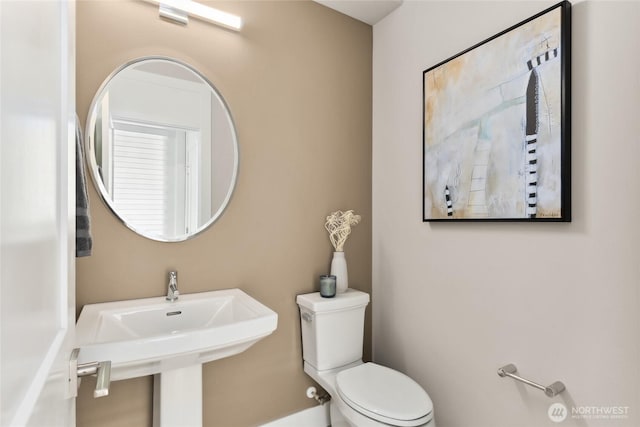 bathroom with a sink and toilet