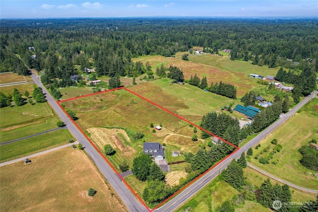 aerial view with a forest view and a rural view