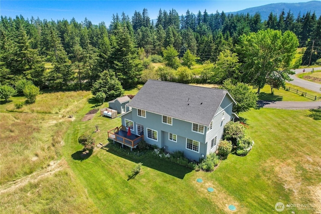 bird's eye view featuring a wooded view