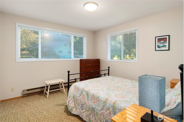 bedroom with a baseboard radiator, carpet, and baseboards