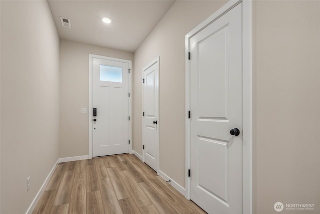 doorway to outside featuring recessed lighting, baseboards, visible vents, and light wood-type flooring