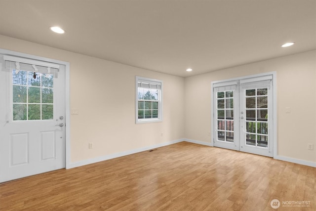 interior space featuring french doors, recessed lighting, light wood-style flooring, and baseboards