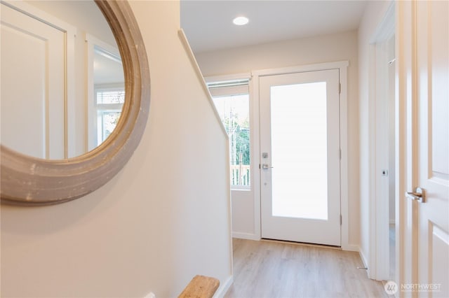 entryway featuring plenty of natural light, baseboards, light wood-style flooring, and recessed lighting