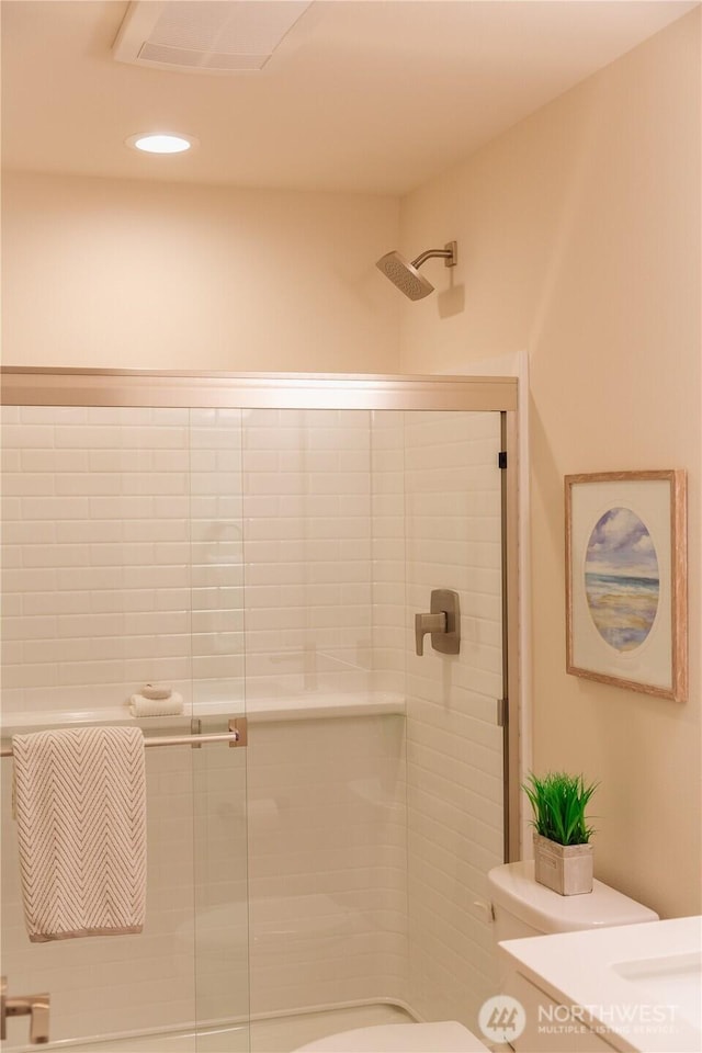 full bathroom featuring visible vents, a shower stall, toilet, and recessed lighting