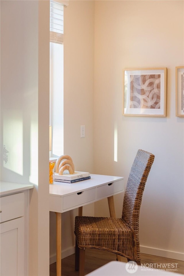 interior space featuring baseboards