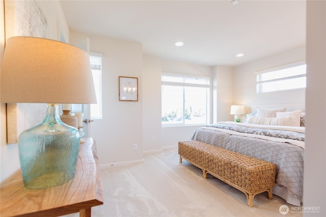 bedroom featuring recessed lighting, light colored carpet, and baseboards