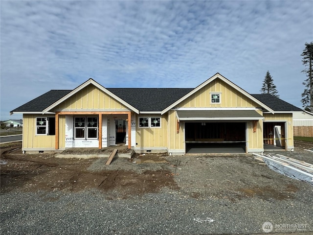 property in mid-construction with a shingled roof, crawl space, driveway, and an attached garage