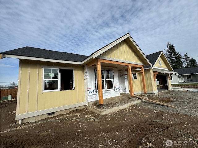 property under construction featuring a garage, a porch, crawl space, and a shingled roof