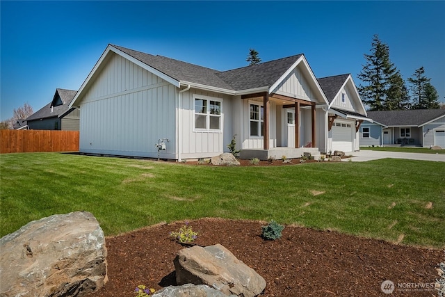 view of front of house with a garage, driveway, board and batten siding, roof with shingles, and fence