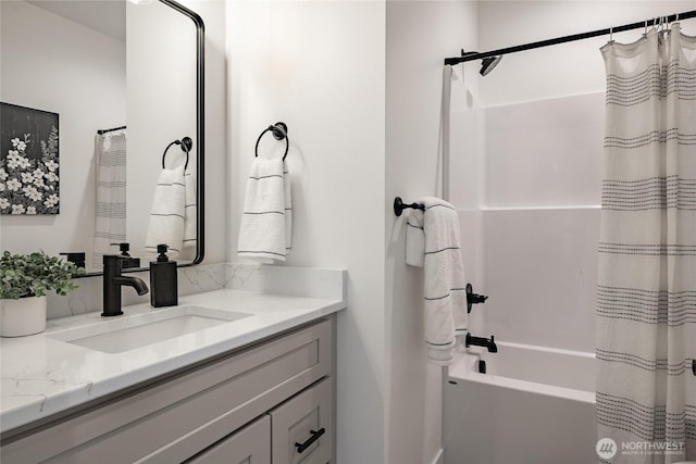 full bath with shower / tub combo and vanity