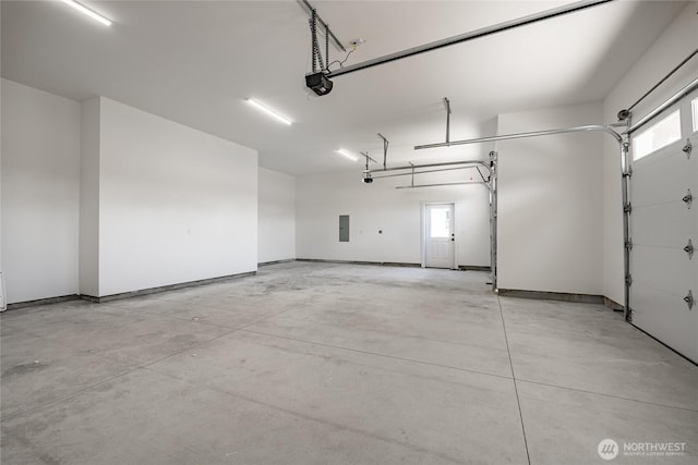garage featuring a garage door opener and electric panel