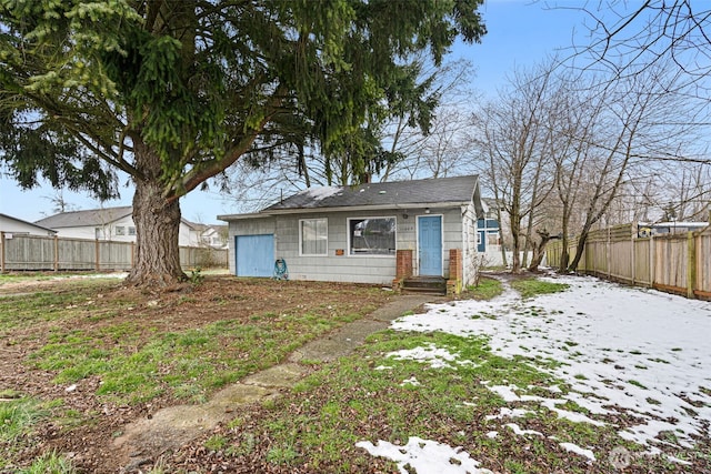 view of front of house featuring a fenced backyard