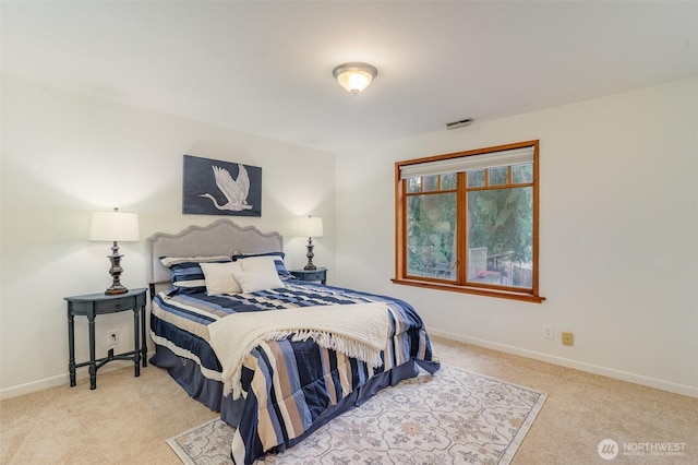 carpeted bedroom with baseboards