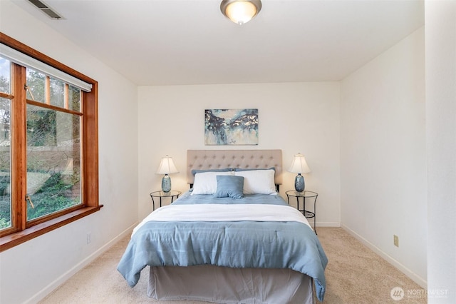 bedroom featuring carpet flooring, visible vents, and baseboards