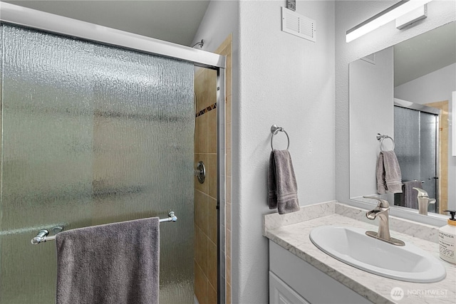 1000 Sr 150, Manson, WA 98831 - bathroom featuring visible vents, a shower stall, and vanity