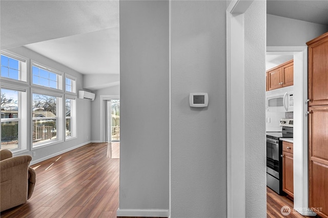 1000 Sr 150, Manson, WA 98831 - hallway featuring baseboards, a wall unit AC, and dark wood finished floors