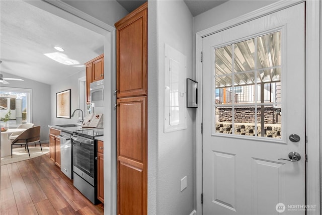 1000 Sr 150, Manson, WA 98831 - kitchen featuring brown cabinets, a sink, appliances with stainless steel finishes, ceiling fan, and dark wood-style flooring
