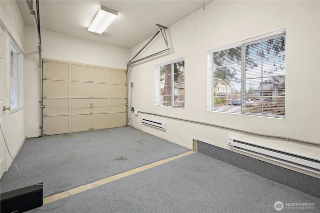 garage with a baseboard heating unit