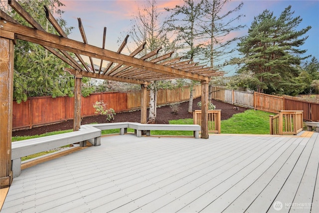 wooden deck featuring a fenced backyard and a pergola