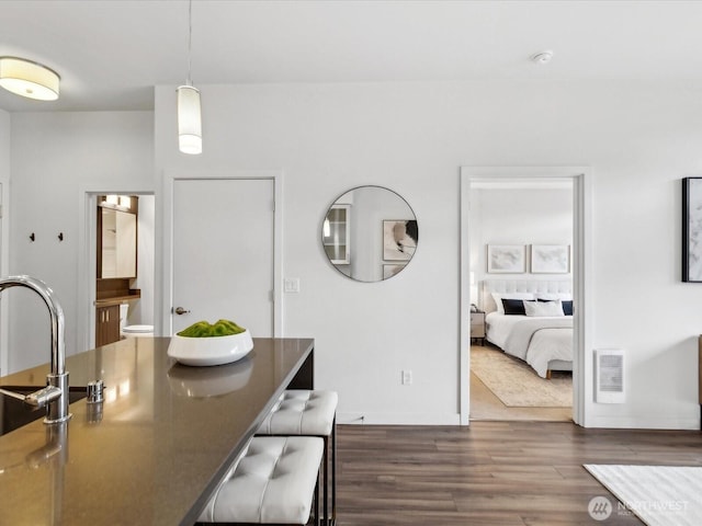 interior space featuring dark wood finished floors and baseboards