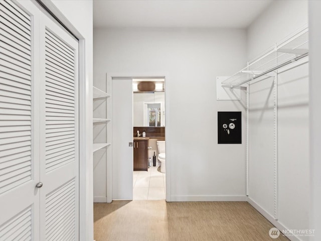 walk in closet featuring light wood-type flooring