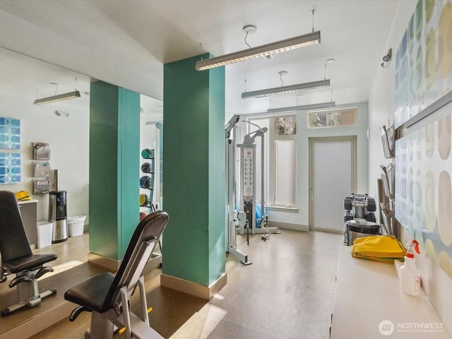 workout area featuring baseboards