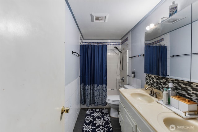 full bath with toilet, a sink, shower / tub combo with curtain, double vanity, and tasteful backsplash