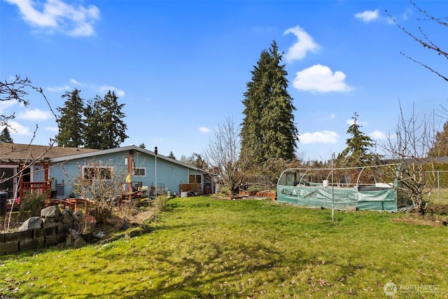 view of yard with a covered pool