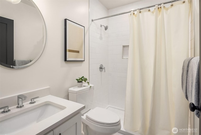 full bath with toilet, a shower stall, and vanity