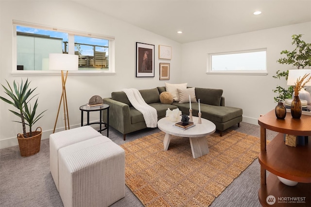 carpeted living area featuring lofted ceiling, baseboards, and recessed lighting