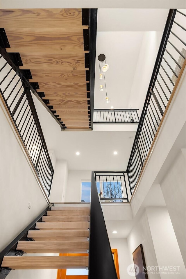 stairway with a towering ceiling