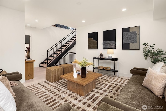 living room with baseboards, stairway, wood finished floors, and recessed lighting