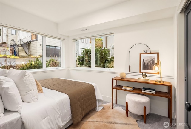 bedroom featuring carpet floors and visible vents